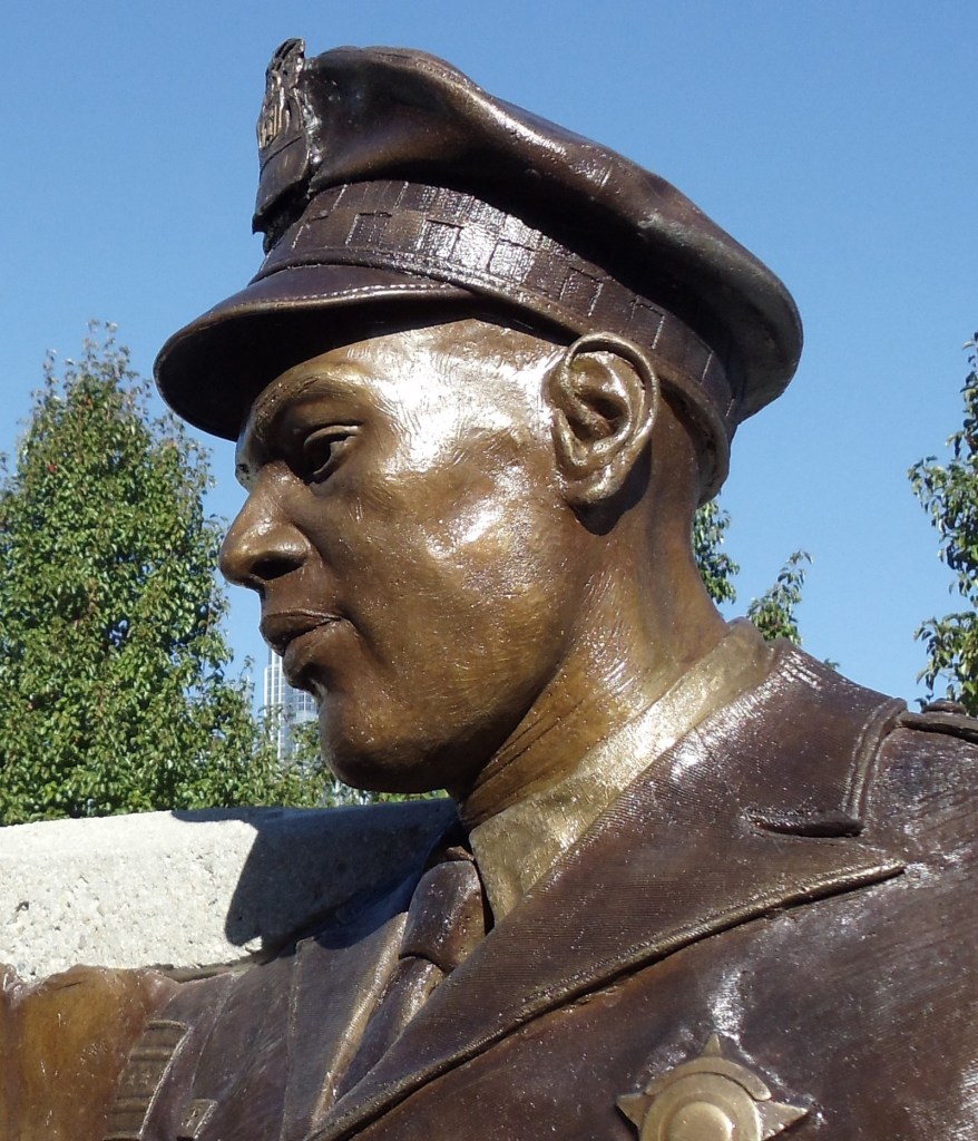 Bronze monument by artist Julie Rotblatt-Amrany, tribute to injured police officers in Chicago, IL