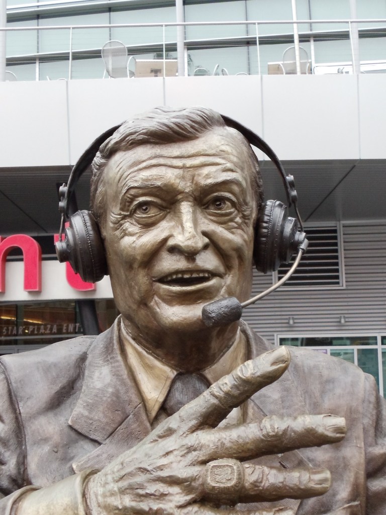 Close up bronze sculpture of Chick Hearn by artist Julie Rotblatt-Amrany for LA Lakers at Staples Center