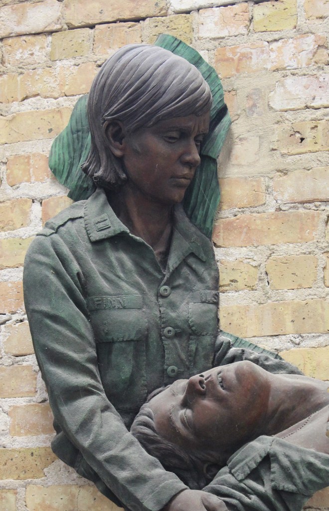 Bronze sculpture of Vietnam War nurse at Community Veterans Memorial Park in Muster, IN by artist Julie Rotblatt-Amrany