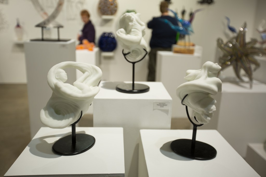Merge, Planetary Mischief, and Emergence, cast glass sculptures by Julie Rotblatt-Amrany at SOFA, Chicago Hive Contemporary Gallery